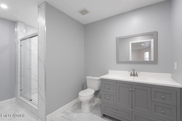 bathroom featuring vanity, an enclosed shower, and toilet