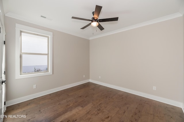 empty room with ornamental molding, dark wood-type flooring, and ceiling fan