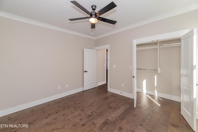 unfurnished bedroom with ceiling fan, ornamental molding, and dark hardwood / wood-style floors