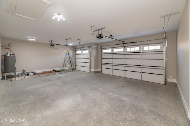 garage with electric water heater and a garage door opener