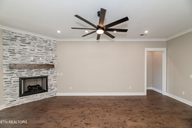 unfurnished living room featuring ceiling fan, crown molding, dark hardwood / wood-style floors, and a fireplace