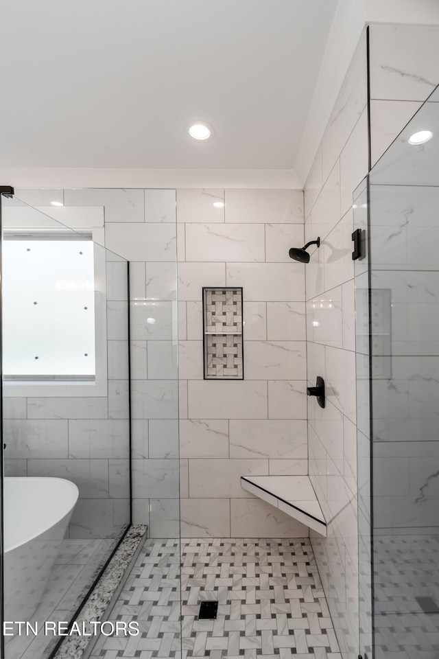 bathroom featuring plus walk in shower