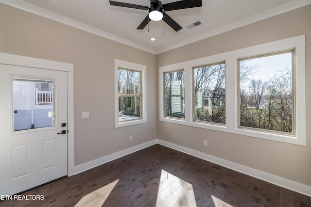 foyer entrance with ceiling fan, dark hardwood / wood-style flooring, and ornamental molding