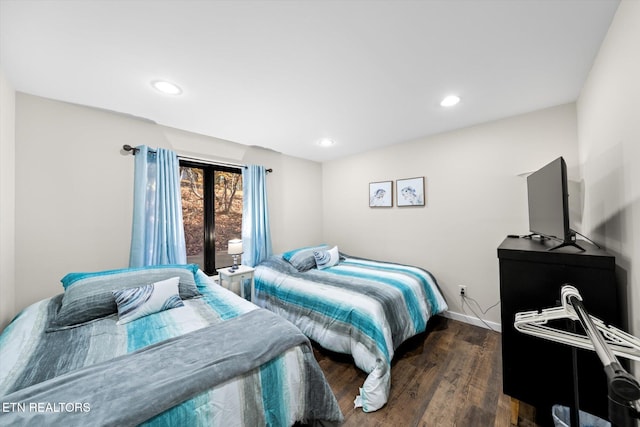 bedroom featuring dark hardwood / wood-style flooring