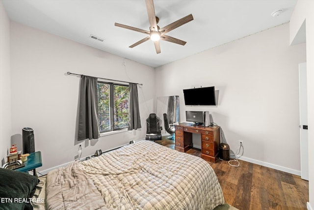 bedroom featuring ceiling fan and dark hardwood / wood-style floors