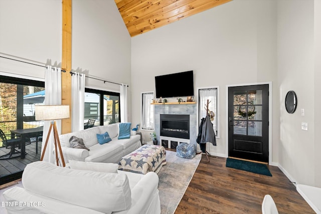 living room with dark hardwood / wood-style floors, wood ceiling, and high vaulted ceiling