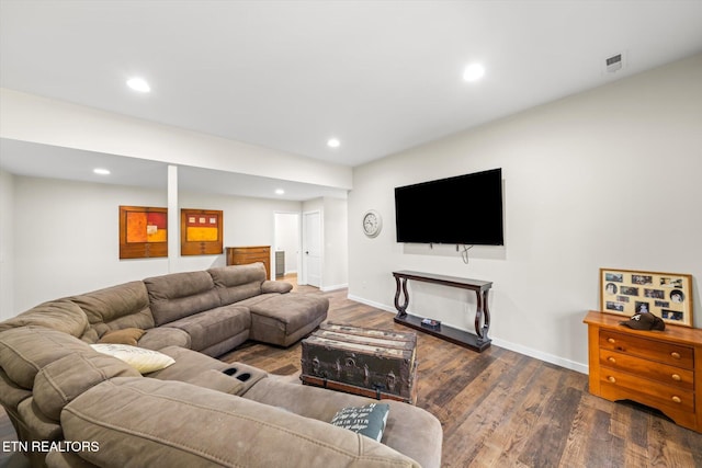 living room with dark hardwood / wood-style flooring