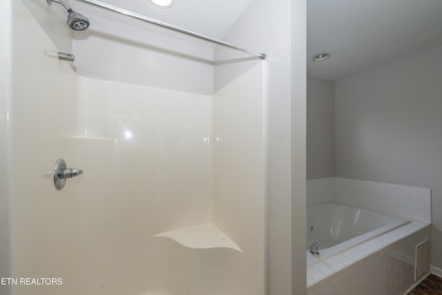 bathroom with tiled bath