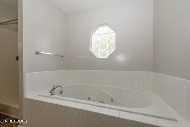 bathroom with tiled bath