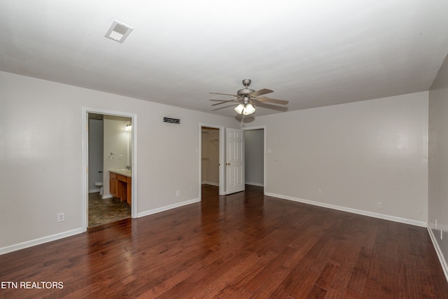 interior space with ceiling fan and dark hardwood / wood-style floors