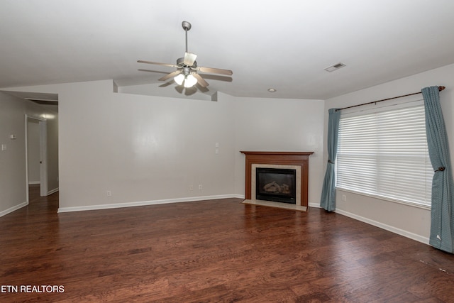 unfurnished living room featuring lofted ceiling, ceiling fan, and dark hardwood / wood-style flooring