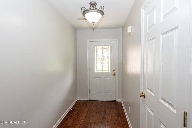 doorway with dark wood-type flooring