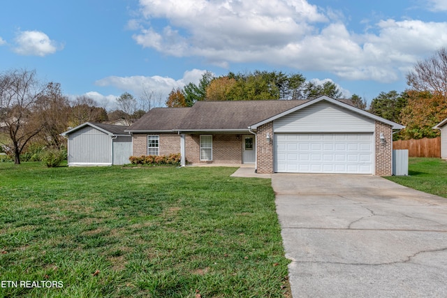 ranch-style house with a garage and a front lawn