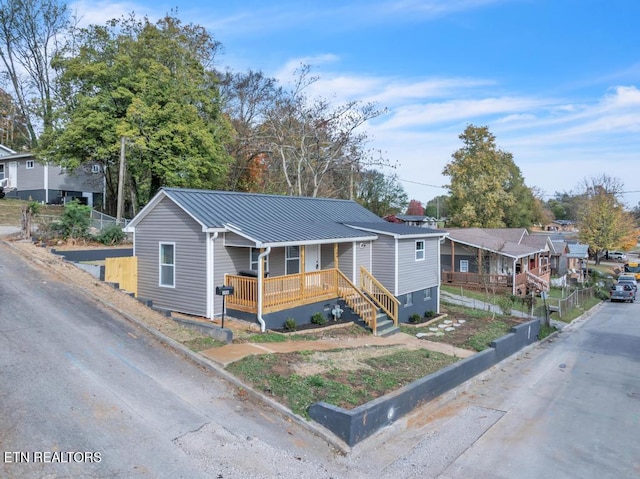 208 Collins St, Loudon, TN 37774 - view of front facade featuring covered porch