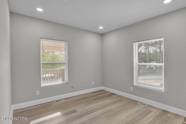 208 Collins St, Loudon, TN 37774 - empty room with plenty of natural light and light hardwood / wood-style flooring