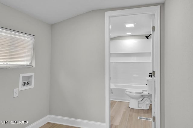 208 Collins St, Loudon, TN 37774 - clothes washing area with light wood-type flooring and hookup for a washing machine
