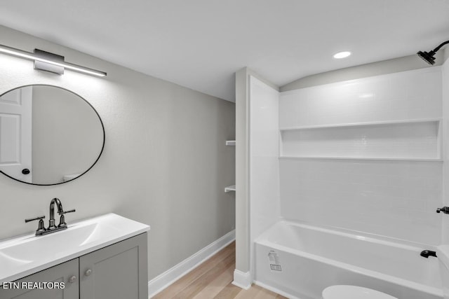 208 Collins St, Loudon, TN 37774 - full bathroom with vanity, hardwood / wood-style flooring, toilet, and tub / shower combination