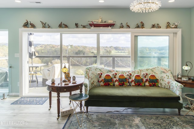 interior space featuring a wealth of natural light and a chandelier