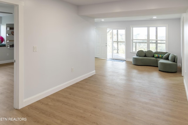 unfurnished living room with light wood-type flooring