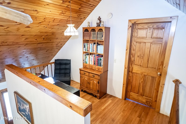 interior space featuring wooden ceiling, lofted ceiling, and hardwood / wood-style floors