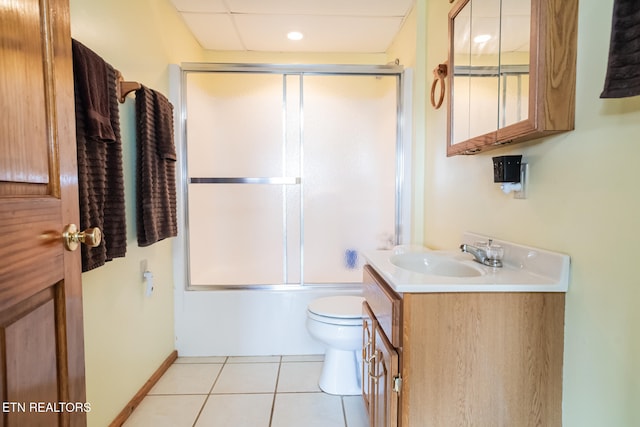 full bathroom featuring vanity, enclosed tub / shower combo, tile patterned floors, and toilet