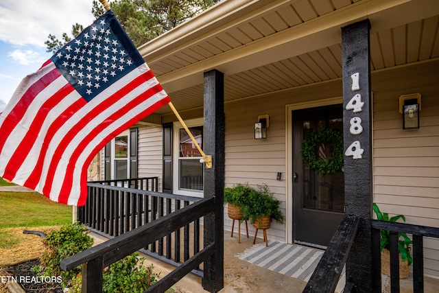 doorway to property featuring a porch