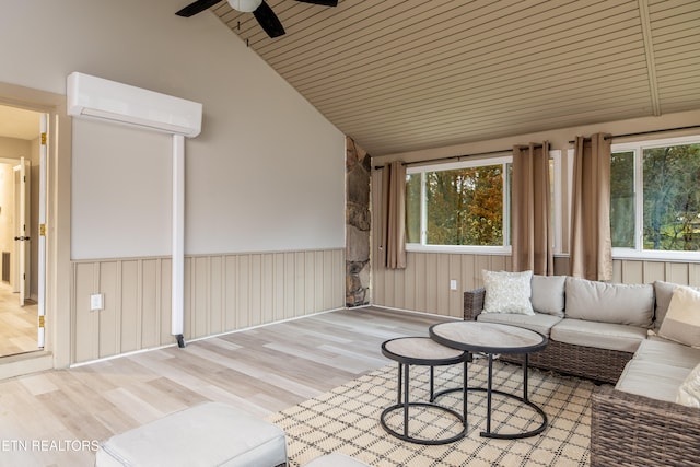 living room featuring wooden ceiling, light hardwood / wood-style flooring, vaulted ceiling, ceiling fan, and a wall unit AC