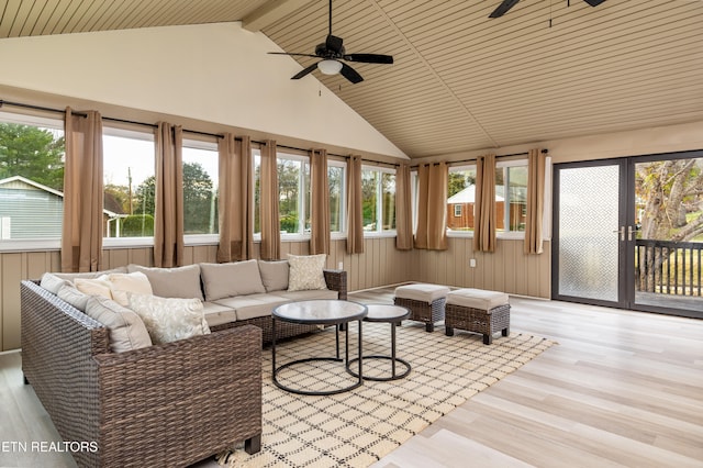 sunroom / solarium with lofted ceiling with beams, plenty of natural light, and wood ceiling