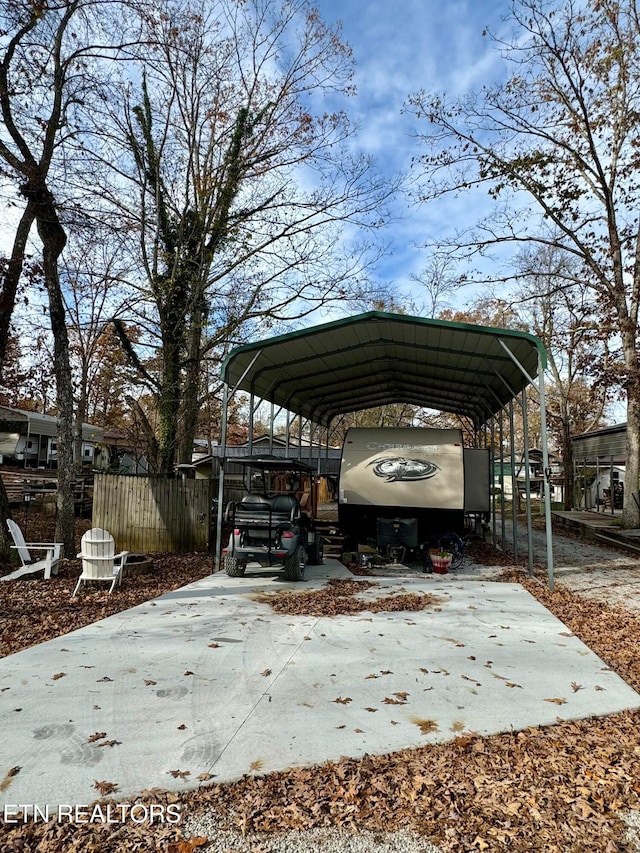 view of parking / parking lot featuring a carport