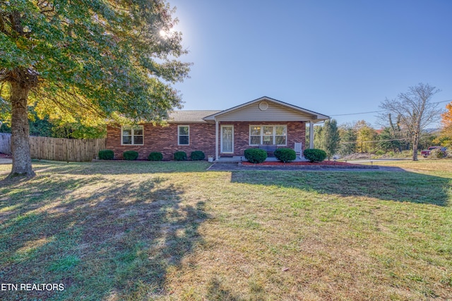 ranch-style house with a front yard