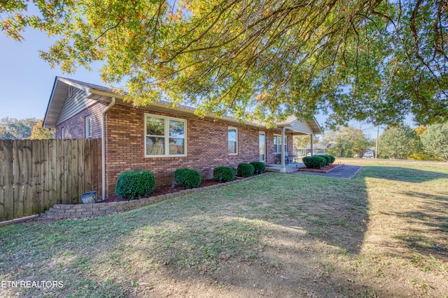 view of front of property with a front lawn and a patio area