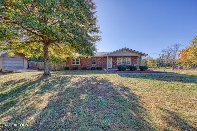 view of front of home featuring a garage and a front lawn