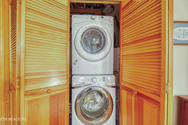 laundry area featuring stacked washer and clothes dryer