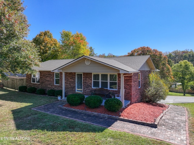 ranch-style house with a front lawn