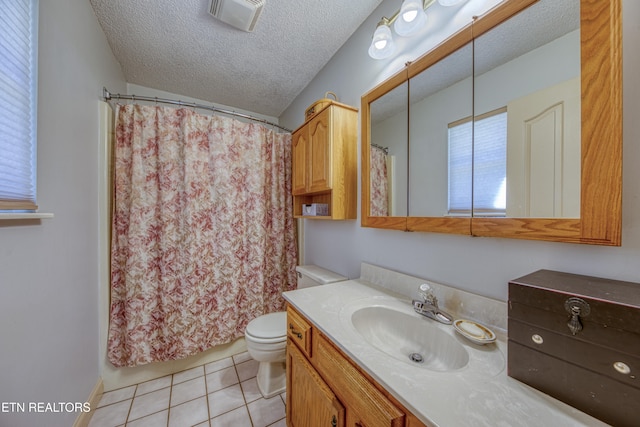 bathroom featuring a shower with curtain, a textured ceiling, vanity, tile patterned floors, and toilet