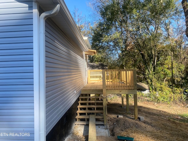 view of home's exterior with a wooden deck