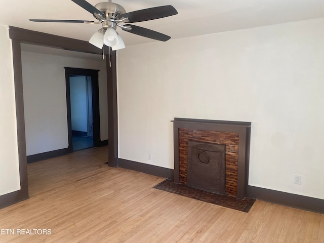 unfurnished living room with ceiling fan and light hardwood / wood-style flooring