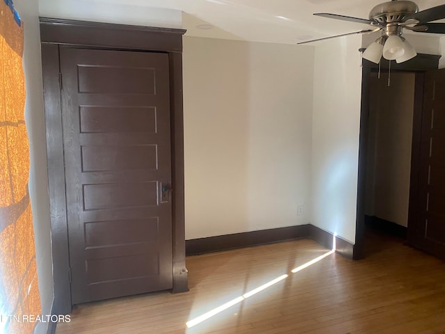 spare room featuring light hardwood / wood-style floors and ceiling fan