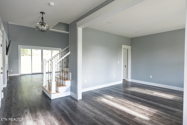 unfurnished room with dark wood-type flooring