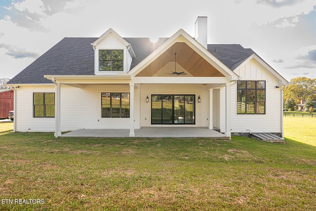 rear view of property featuring a patio area, a yard, and ceiling fan