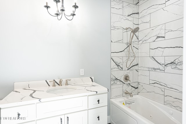 bathroom featuring vanity and tiled shower / bath combo