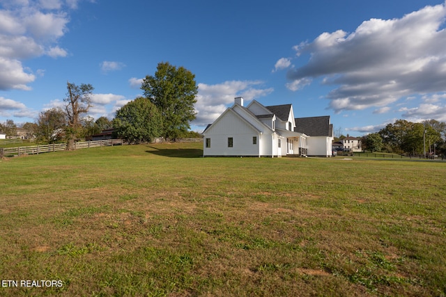 exterior space featuring a yard and a rural view