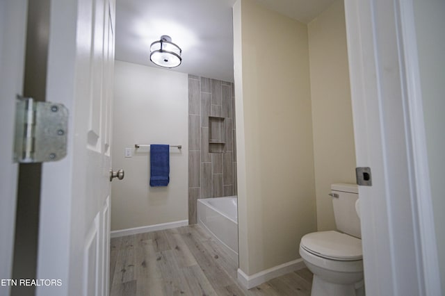 bathroom with wood-type flooring and toilet