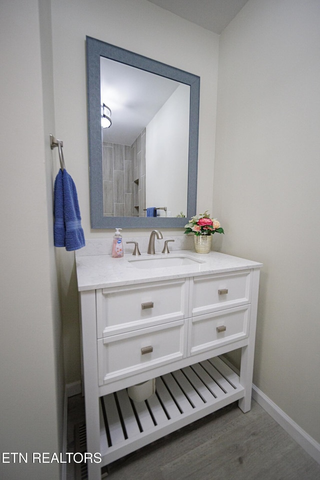 bathroom featuring vanity and hardwood / wood-style floors