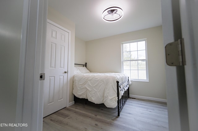 bedroom with light hardwood / wood-style flooring