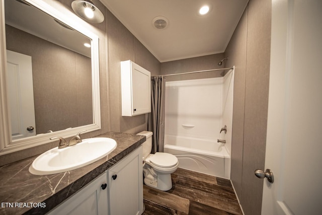 full bathroom featuring wood-type flooring, vanity, toilet, and shower / bath combination with curtain