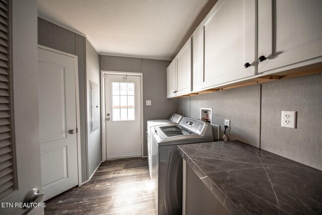 laundry room with cabinets, dark hardwood / wood-style floors, and independent washer and dryer