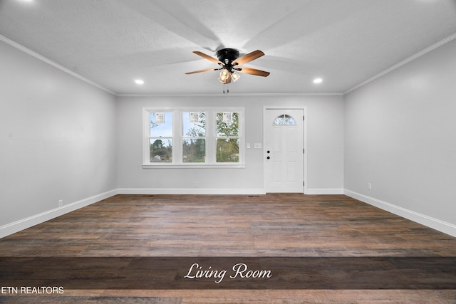 foyer entrance with a textured ceiling, ceiling fan, dark hardwood / wood-style floors, and crown molding