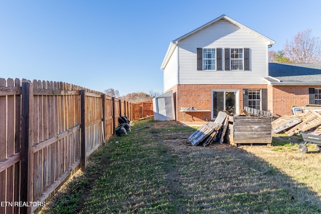 back of property featuring a yard