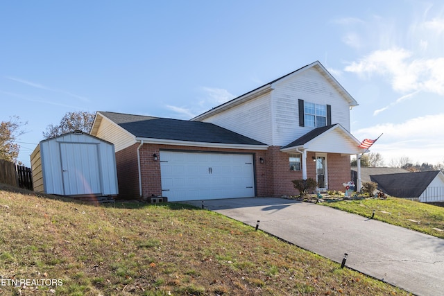 view of front facade with a storage unit, a garage, and a front lawn